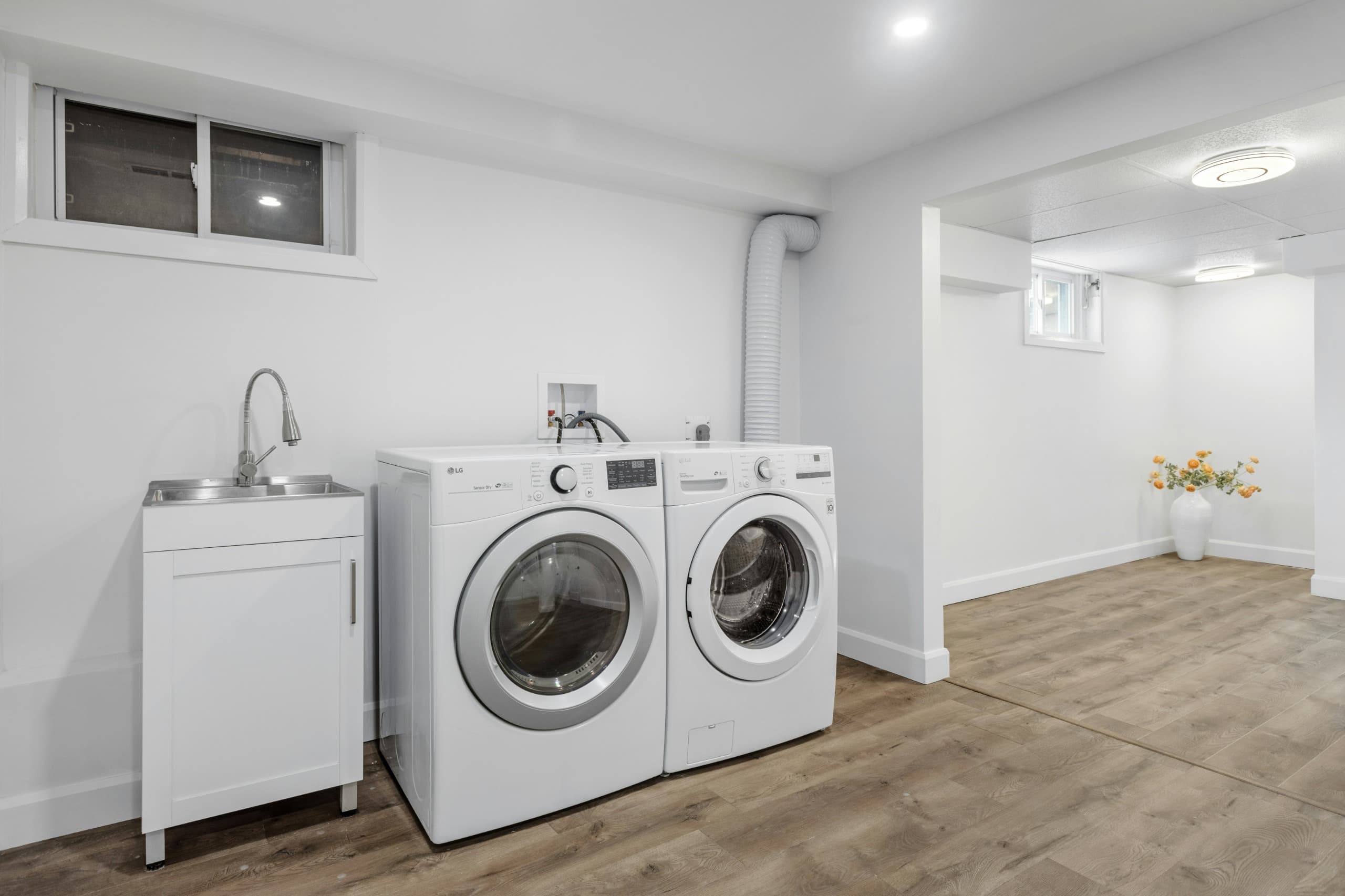 Modern laundry corner with organized machine placement